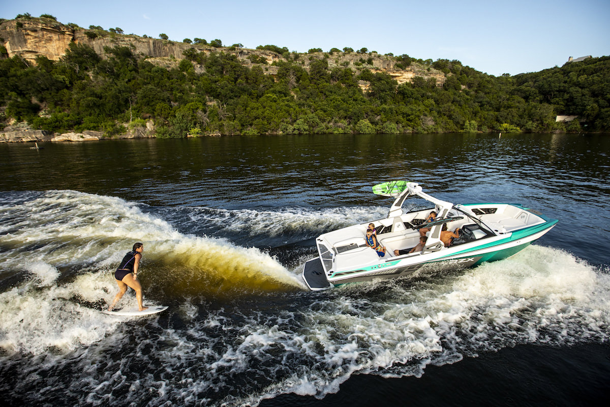 Tige 22RZX pulling a wakesurfer. The wakesurfer can control his wake with a remote or save his settings on the boat's computer so anyone can drive him the way he likes